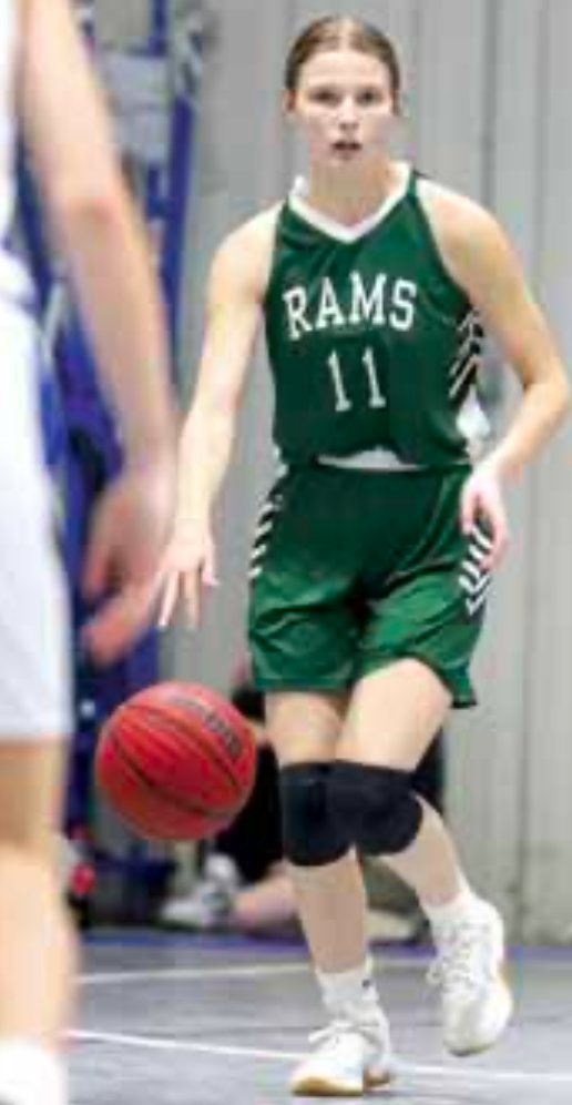Jeana Dudley (11) dribbles the ball into the front court in a game for the Lady Rams.